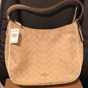 Brand new coach purse with tags still on it